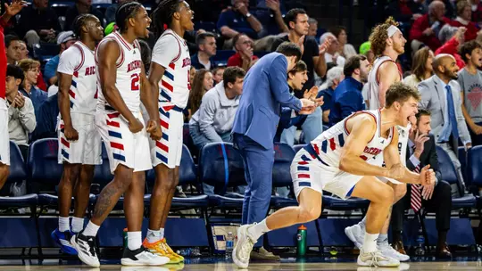 Mike Walz leaps off the bench to offer encouragement