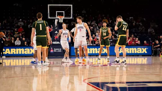 Mike Walz takes the court for the opening tip