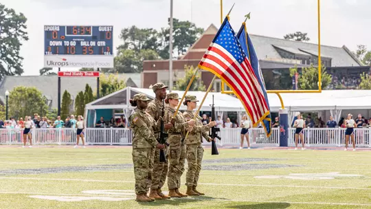 ROTC stands with flags