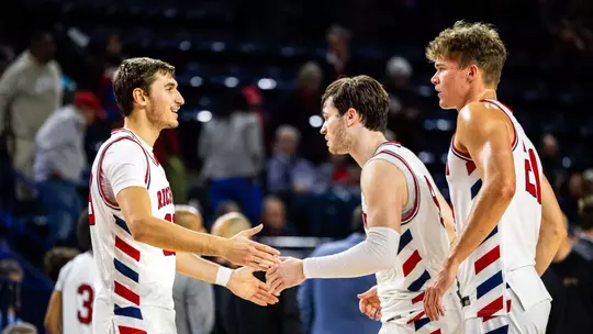 Apostolos Roumoglou slaps hands with Mike Walz and Jonathan Beagle