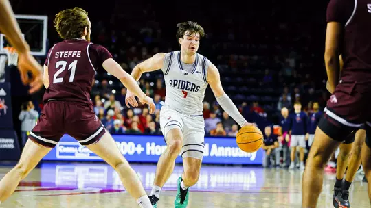 Jonathan Beagle dribbles at the top of the key