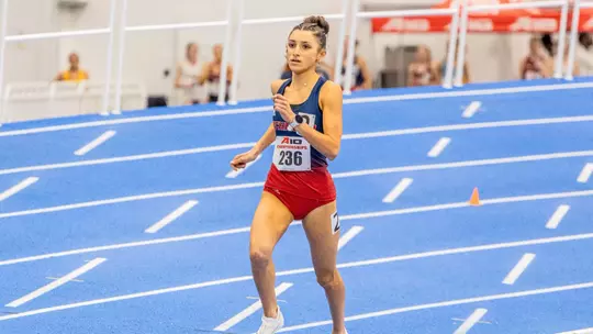 Hallie Muniz running the mile 2025 indoor A-10 Championships