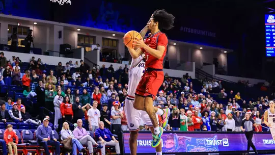 Aiden Argabright leaps in the paint for a layup attempt