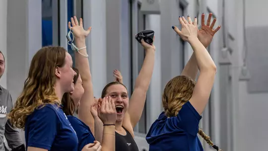 Erin Budde and Team celebrating relay win at 2025 A-10s