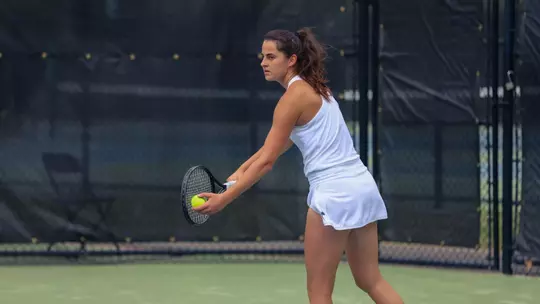 Lara Bakhaya serving the ball