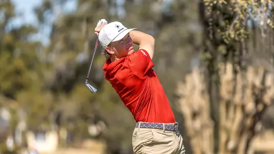 Parker Moellinger stares down his tee shot