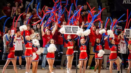 Cheerleaders and fans yell at the Robins Center