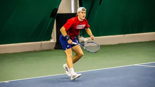 Charlie Burdell in a singles match