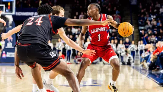 Mikkel Tyne retreats vs two defenders