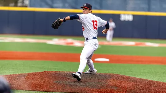 Angel Santiago-Cruz looks over his shoulder to throw the pitch towards home