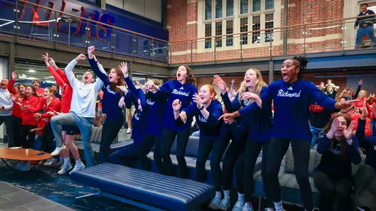 Members of the women's basketball team react to their name being called during the NCAA Selection Show