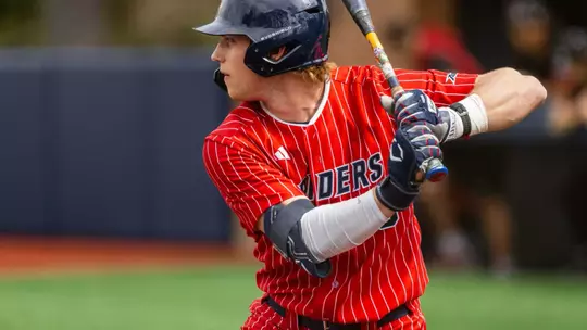 Evan Wilson waits for the pitch with his hands ready to swing