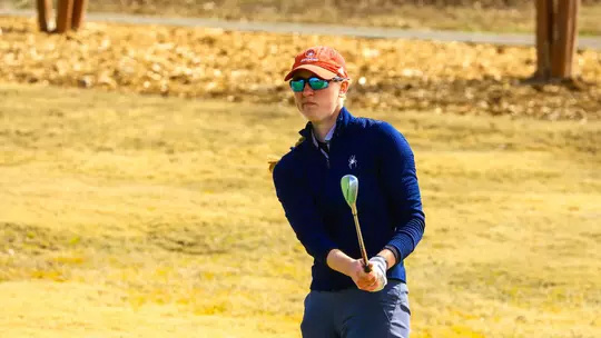 Addie Doroh evaluates her chip from the rough