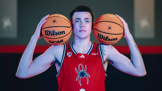 Jack McCaffery holds two balls next to his ears