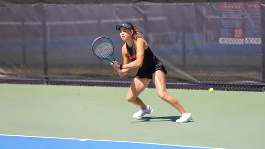Barbulescu chasing a ball in a tennis match
