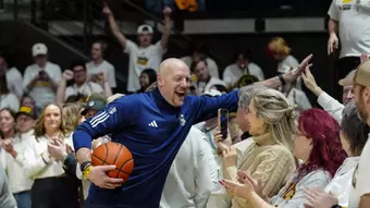 Sundance Wicks celebrates with the crowd after the Border War.