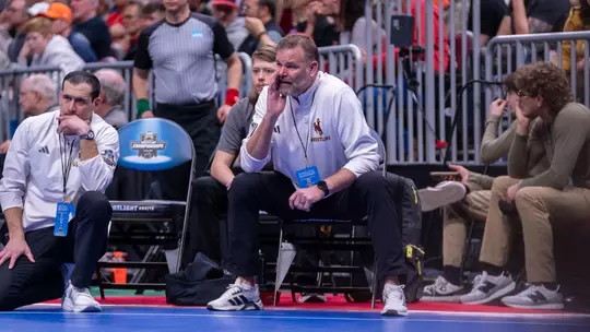 Head coach Mark Branch coaches during the NCAA Championships in Cleveland, Ohio