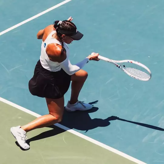 Yekaterina Dmitrichenko hits a forehand against Texas.