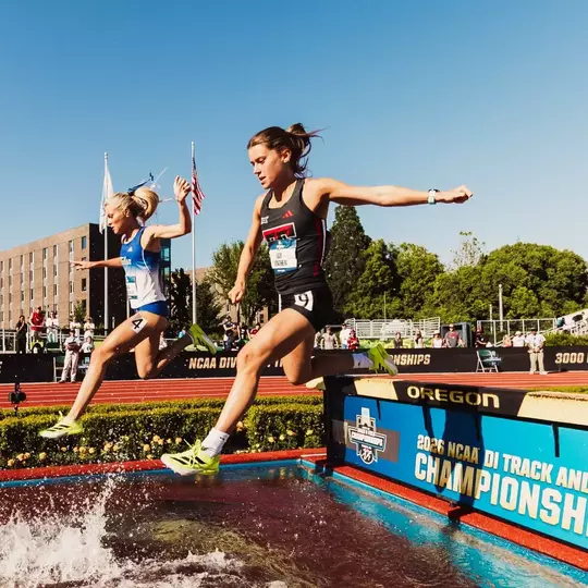 Lily Mather jumping over the water barrier