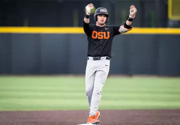 Ethan Porter celebrates after hitting a double against Oregon