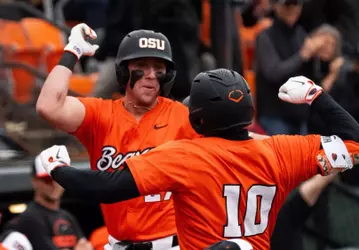 Paul Vazquez and Bryce Hubbard celebrate after the latter hit a home run versus Xavier on March 8, 2026