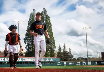 Ethan Kleinschmit and Jacob Galloway walk in from the bullpen before the lefty's start against Cal Poly in April 2026