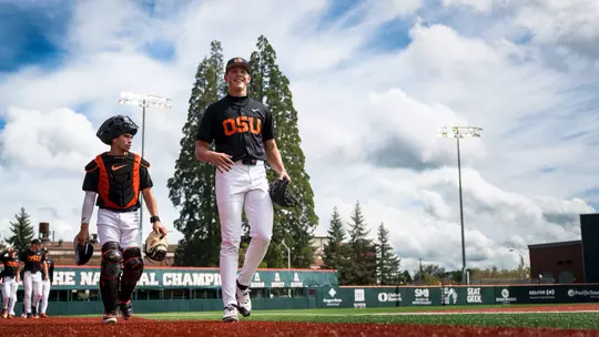 Ethan Kleinschmit and Jacob Galloway walk in from the bullpen before the lefty's start against Cal Poly in April 2026