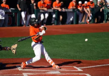 AJ Singer takes a swing on a pitch that he hit for a grand slam against Cal State Fullerton on April 18, 2026