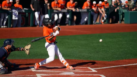 AJ Singer takes a swing on a pitch that he hit for a grand slam against Cal State Fullerton on April 18, 2026