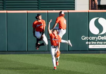 Three Beavers celebrate after Oregon State's win over Cal State Fullerton on April 18, 2026