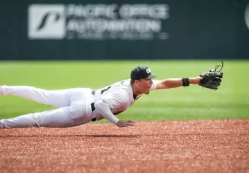 Cooper Vance dives to field a ground ball against Cal State Fullerton on April 19, 2026