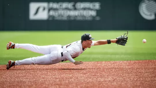 Cooper Vance dives to field a ground ball against Cal State Fullerton on April 19, 2026