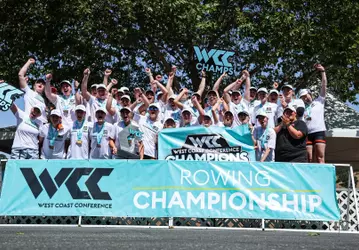 Women's rowing celebrating a WCC Championship.