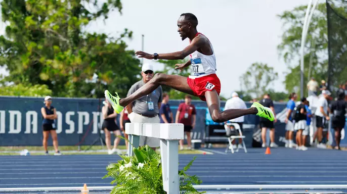 Geoffrey Kirwa hurdles the water barrier in the 3000m steeplechase at the 2025 NCAA East Regional.