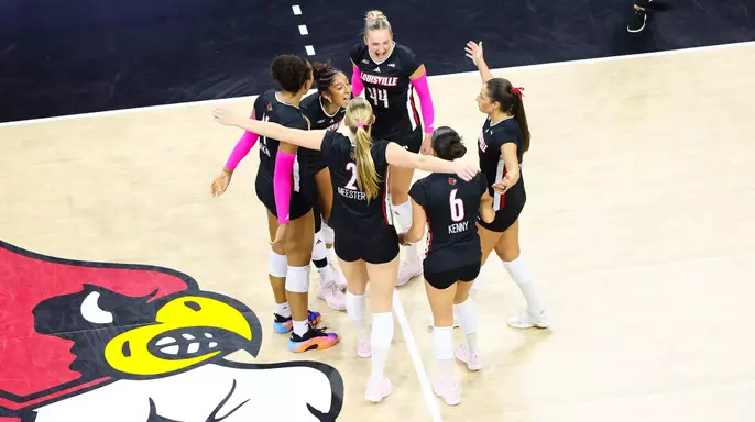 Louisville celebrates a point against Stanford