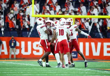 Cards' Defense Celebrates Against Syracuse
