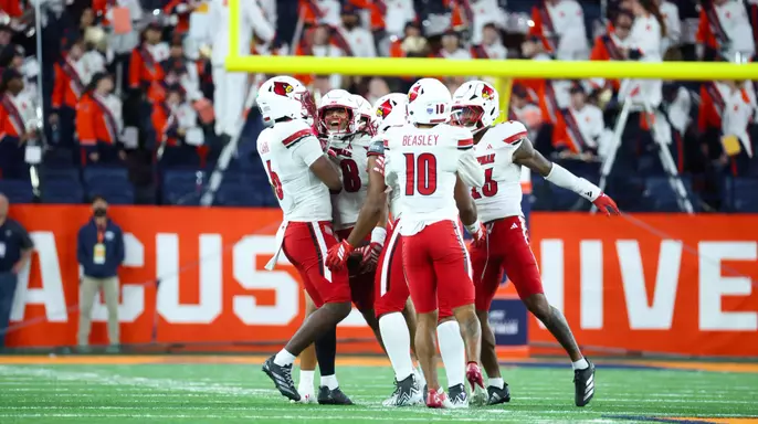 Cards' Defense Celebrates Against Syracuse