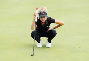 Madison Moman eyes a putt