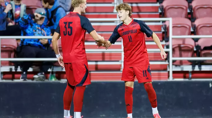 Cooper Olson and Brody Mayer celebrate during the game against Spalding at the Dr. Mark and Cindy Lynn Stadium on October 21.