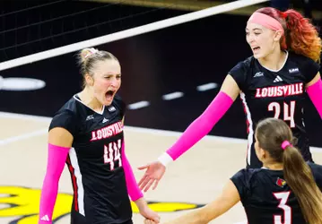 Brooke Bultema, Kalyssa Blackshear and Kamden Schrand celebrate a point against Stanford