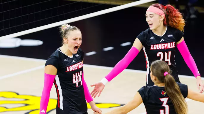 Brooke Bultema, Kalyssa Blackshear and Kamden Schrand celebrate a point against Stanford