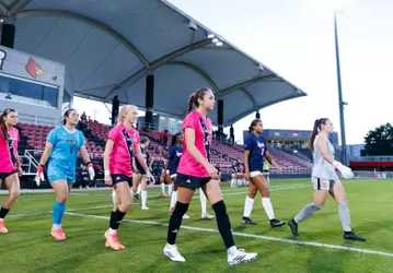 Betsy Huckaby, Liza Suydam, Brielle Baker and Norah Roush walk onto the pitch for introductions vs. Syracuse
