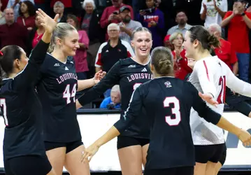 Louisville celebrates a point against Clemson