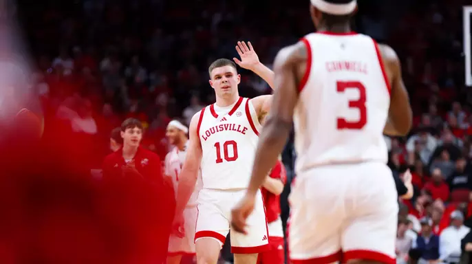 Isaac McKneely high fiving Ryan Conwell