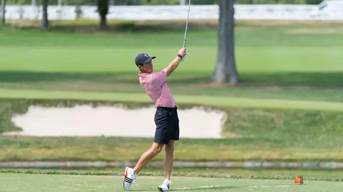 Warren Thomis hitting golf ball
