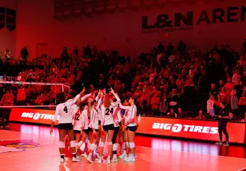 Volleyball huddle wide shot at L&N Federal Credit Union Arena