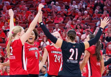 Louisville celebrates a point against Missouri