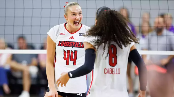 Brooke Bultema and Nayelis Cabello celebrate a point against TCU