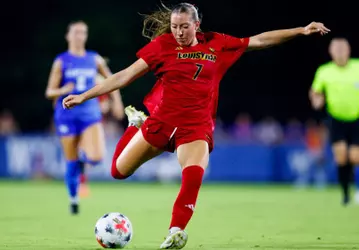 Nicole Jodoin kicking ball