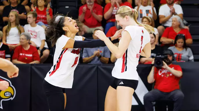 Nayelis Cabello and Chloe Meester celebrate a point during Louisville's win over TCU